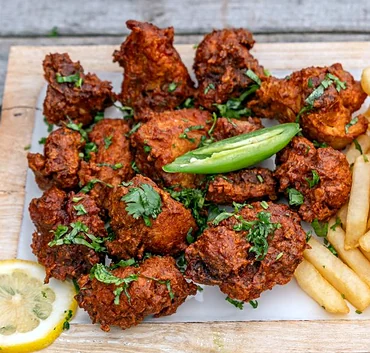 Chicken 65 on a wooden board